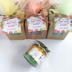 Custom birthday party return gifts featuring Kraft favor boxes wrapped in colorful pastel tulle net & personalized thank-you
