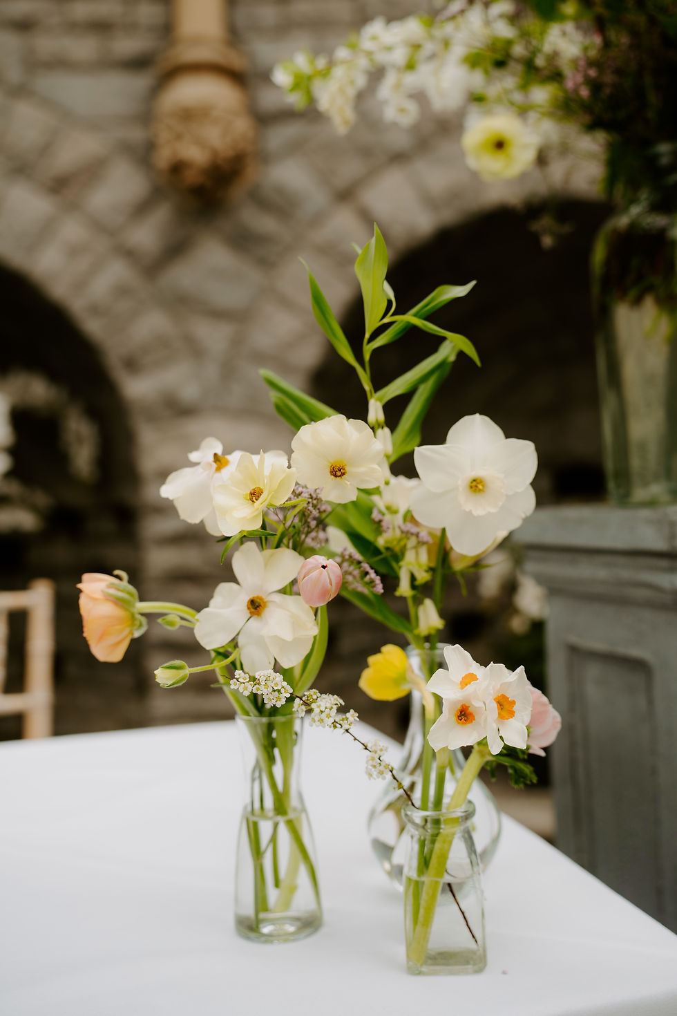 Spring wedding flowers in bud vases