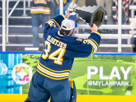 A hockey player celebrating a championship victory.