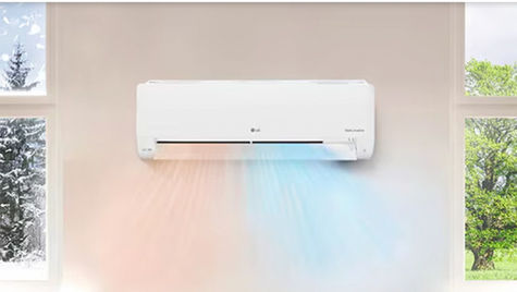 Professional HVAC technician installing whole-home humidifier system for indoor humidity control winter PA home