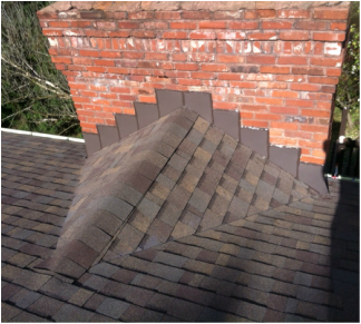 Chimney with a cricket roofing.