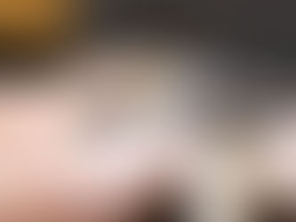 Professional gemologist evaluating diamond jewelry at pawn shop Pennsylvania using magnification and testing equipment