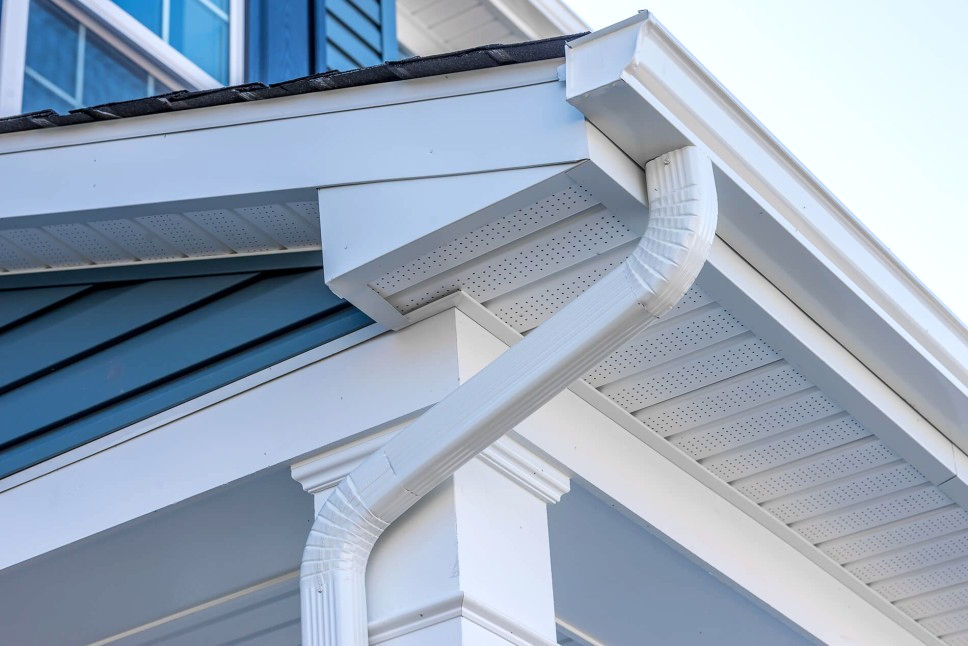 Professional gutter installation company installing seamless gutters on Irwin PA home with proper slope and downspouts