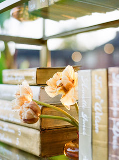 Cream and gold decorative books with light flowers