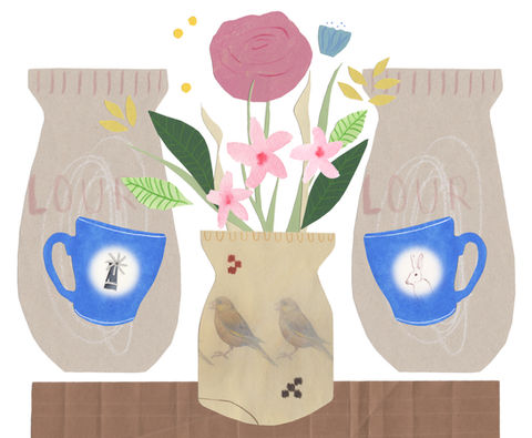 A vase of pink flowers, with two blue tea cups on either side. The tea cups feature small illustrations of a windmill and a rabbit. 