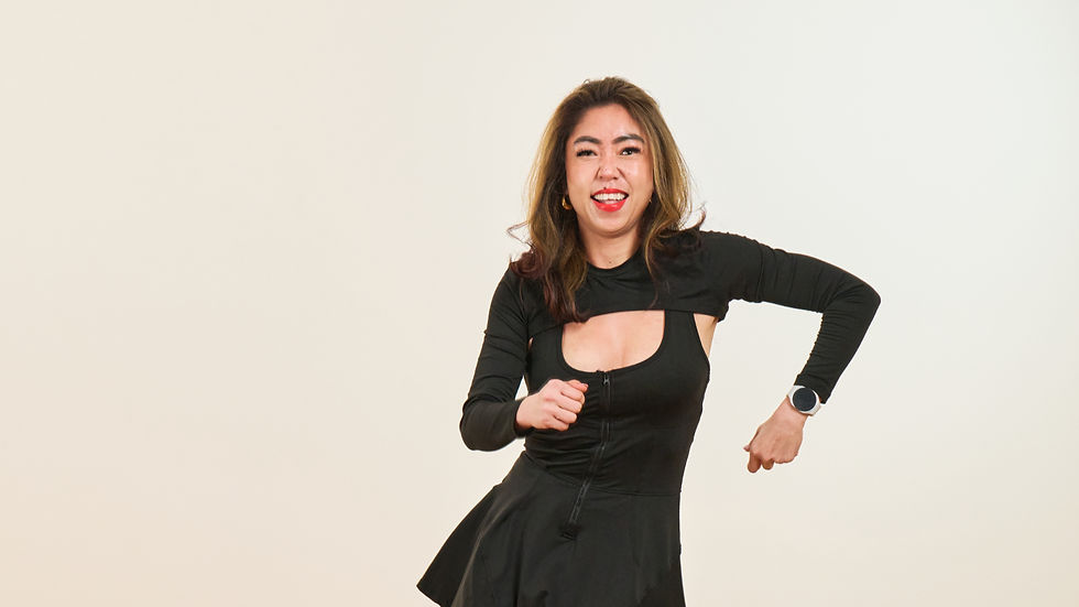 Happy Zumba instructor grooving to her move.