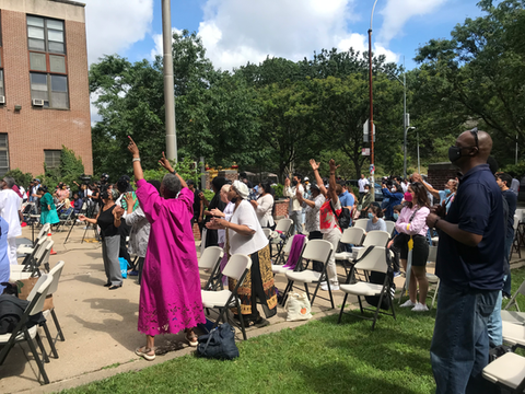 Bethel Gospel Assembly service outside in Harlem