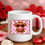 Thumbnail: Pink Checkered Valentine Highland Cow with red bow red heart sunglasses and blowing a pink bubblegum on a mug