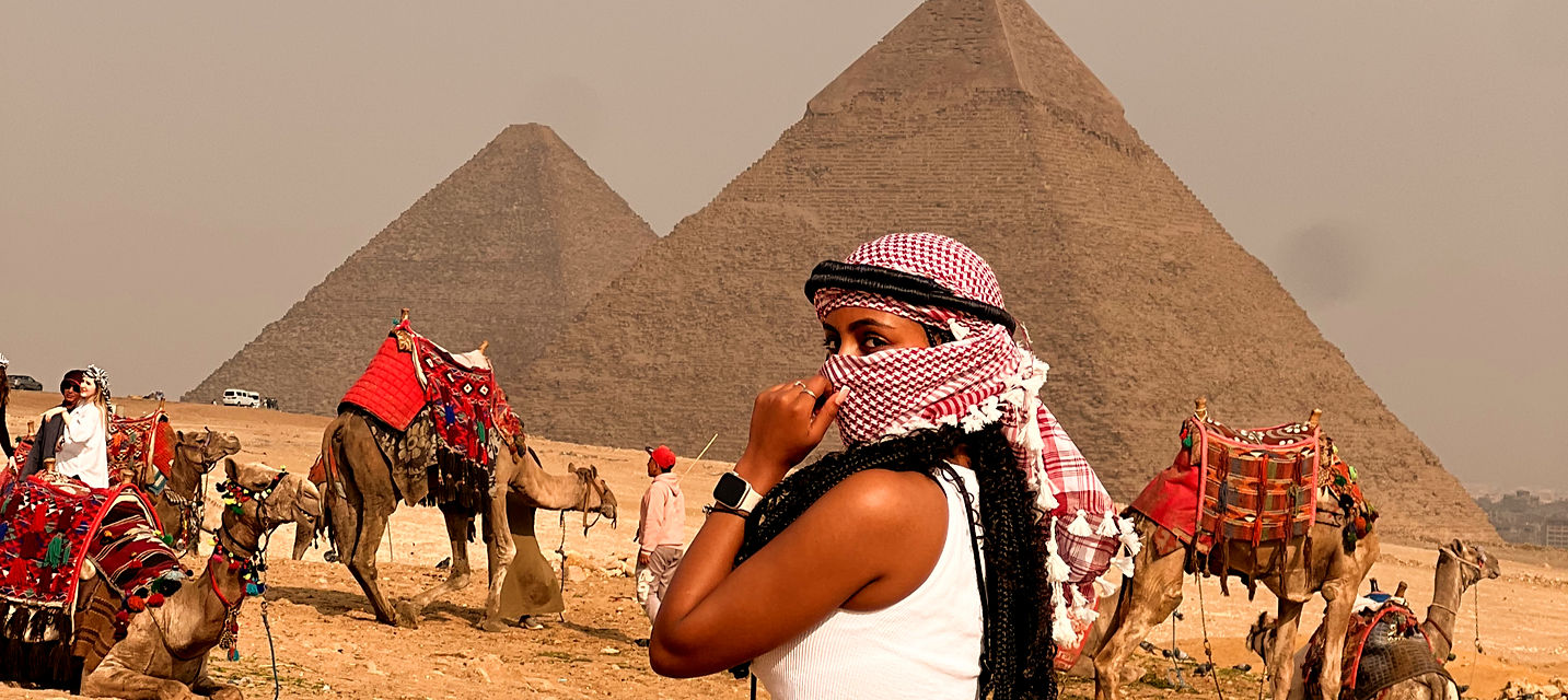 American traveler at the Pyramids of Giza in Egypt 2025 – safe and unforgettable Cairo desert tour with camels, for U.S.A