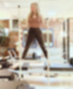 DIY Pilates balance poles made from poplar dowels and chair leg tips — a budget-friendly alternative to the Balanced Body gondola pole for reformer workouts.