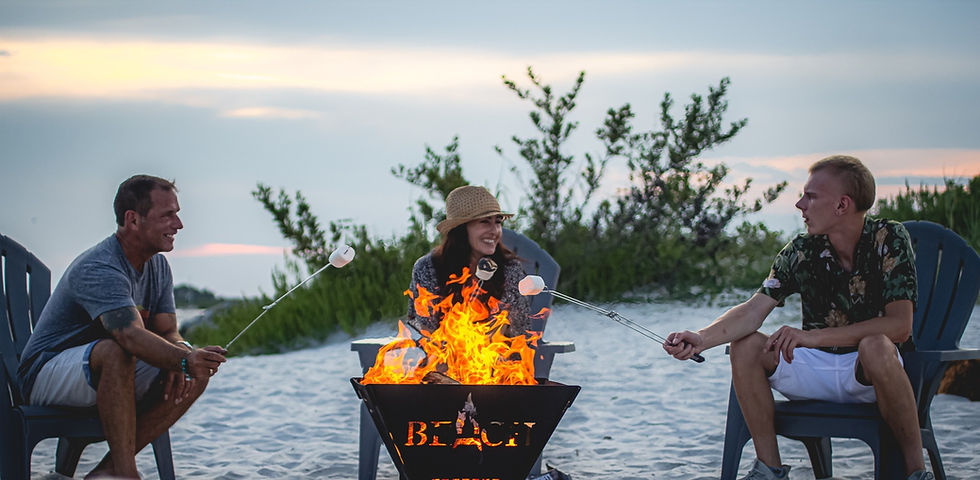 The Beach Campfires Family toasting marshmallows on Ponce Inlet, FL.
