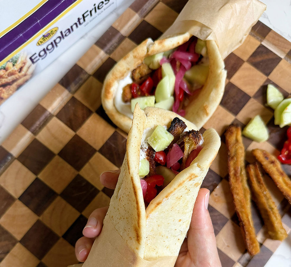 Person holding and Dominex Eggplant Shawarma Pitas