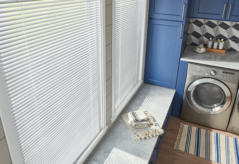 Aluminum blinds from Lumen Shade Solutions showcasing durability and custom fit for various window shapes.