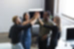 group-young-colleagues-giving-each-other-high-five.jpg