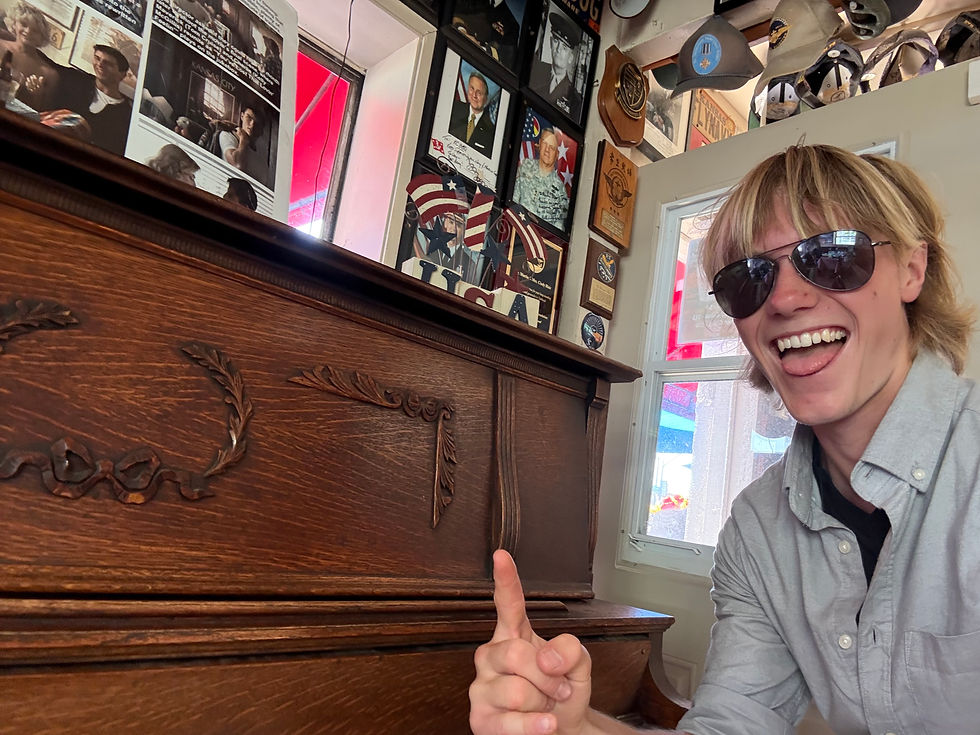 Taking a photo with the legendary piano that Goose played