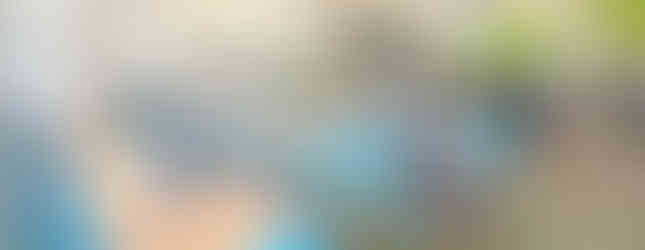 Rows of colorful books line the children’s library, with natural light streaming in and soft seating areas inviting young readers.