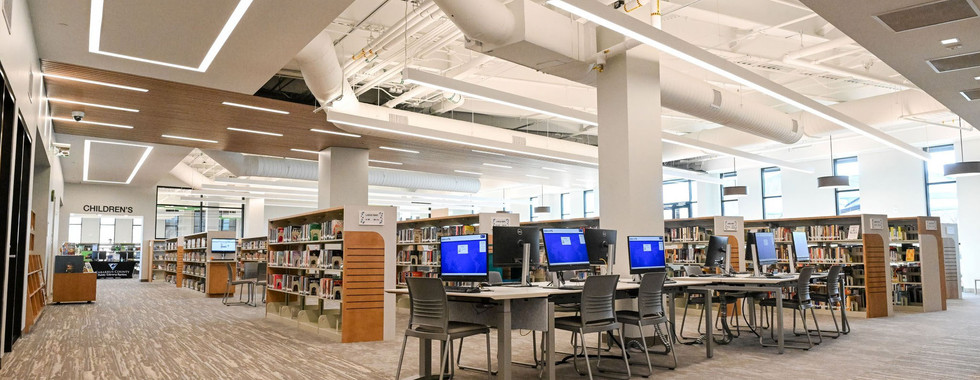 The Cabarrus County Library provides open, tech-equipped workspaces with public computers, modern lighting, and flexible seating.