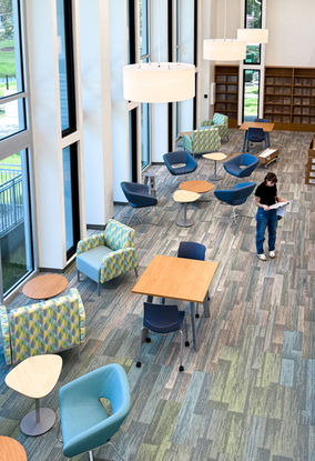 Punch Lists at St. Petersburg Library System, President Barack Obama Main Library in St. Petersburg Florida. Interior Designer Becca Kern meticulously checks interior finishes before the upcoming grand reopening. The interior imitates the beautiful tones of beach glass, seamlessly integrating this new modernized design with the surrounding Florida area.