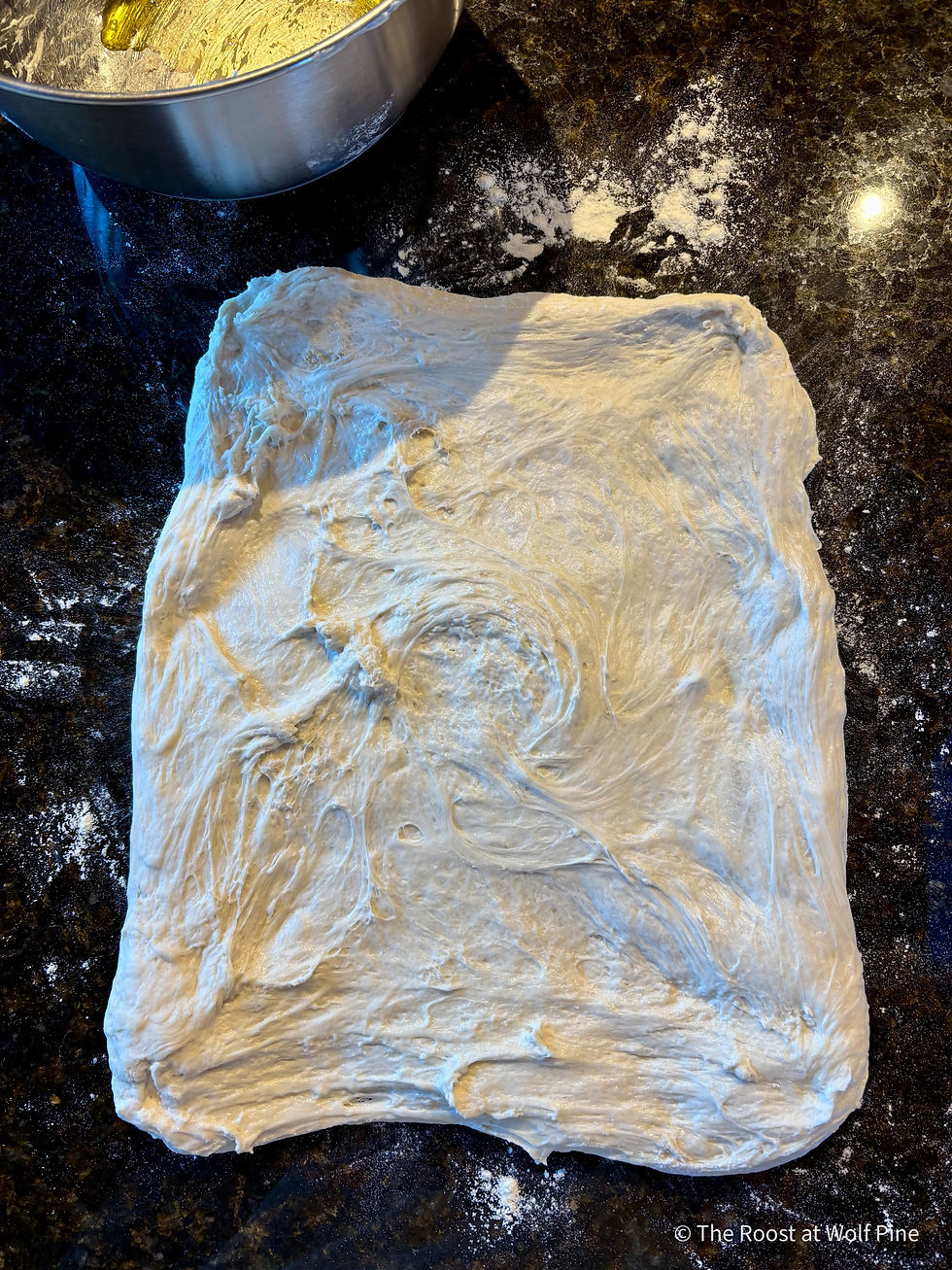 Stretching dough for letter fold to form for final rise.