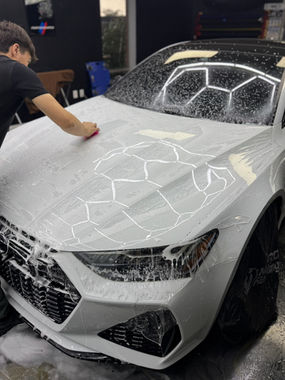 Applying paint protection film PPF Dayton Cincinnati to a car