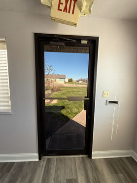 Commercial window tint dayton cincinnati on an exit door.