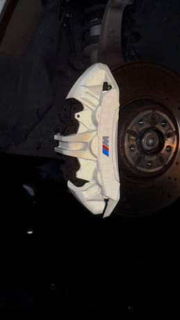 Reflective vehicle wrap on BMW brake calipers in Dayton.