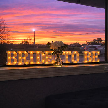 Bride to be sign lobby with sunset_edite