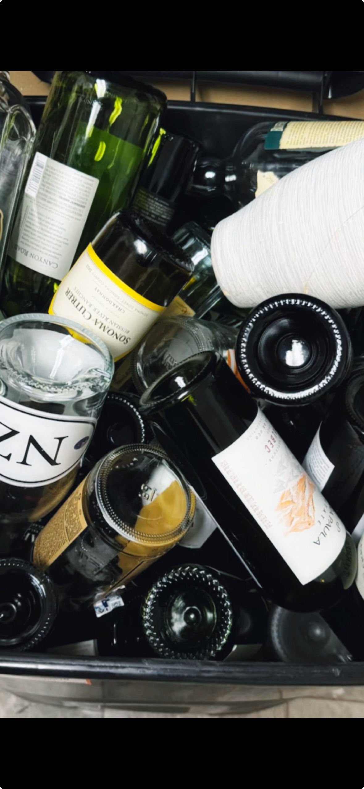 Four glass bottles available as add-ons for a rage room session at Maximum Rage.