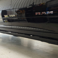 Close-up of black 2024 RAM 3500 Laramie with XPEL PPF applied to lower rocker panels