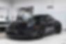 Black 2023 Porsche 911 Targa GTS sitting in a showroom