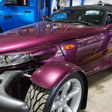 2002 Plymouth Prowler with full-body paint protection film and ceramic coating in a workshop