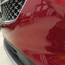 Close-up of red 2021 Buick Envision Avenir with front bumper XPEL PPF installed