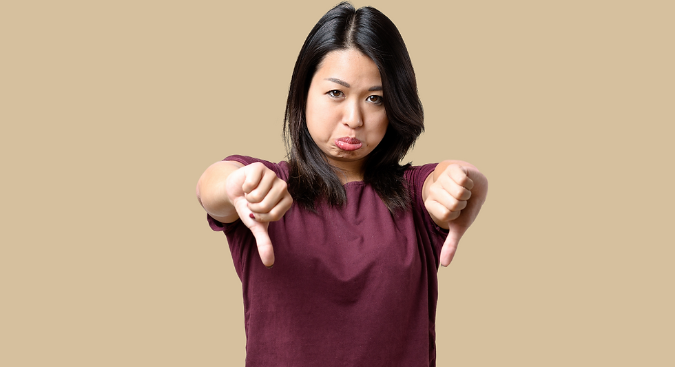 woman pouting with two thumbs down