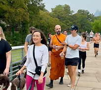 A group spreading out along the path during The Board Walks Austin five-mile community walk for meaningful connection.