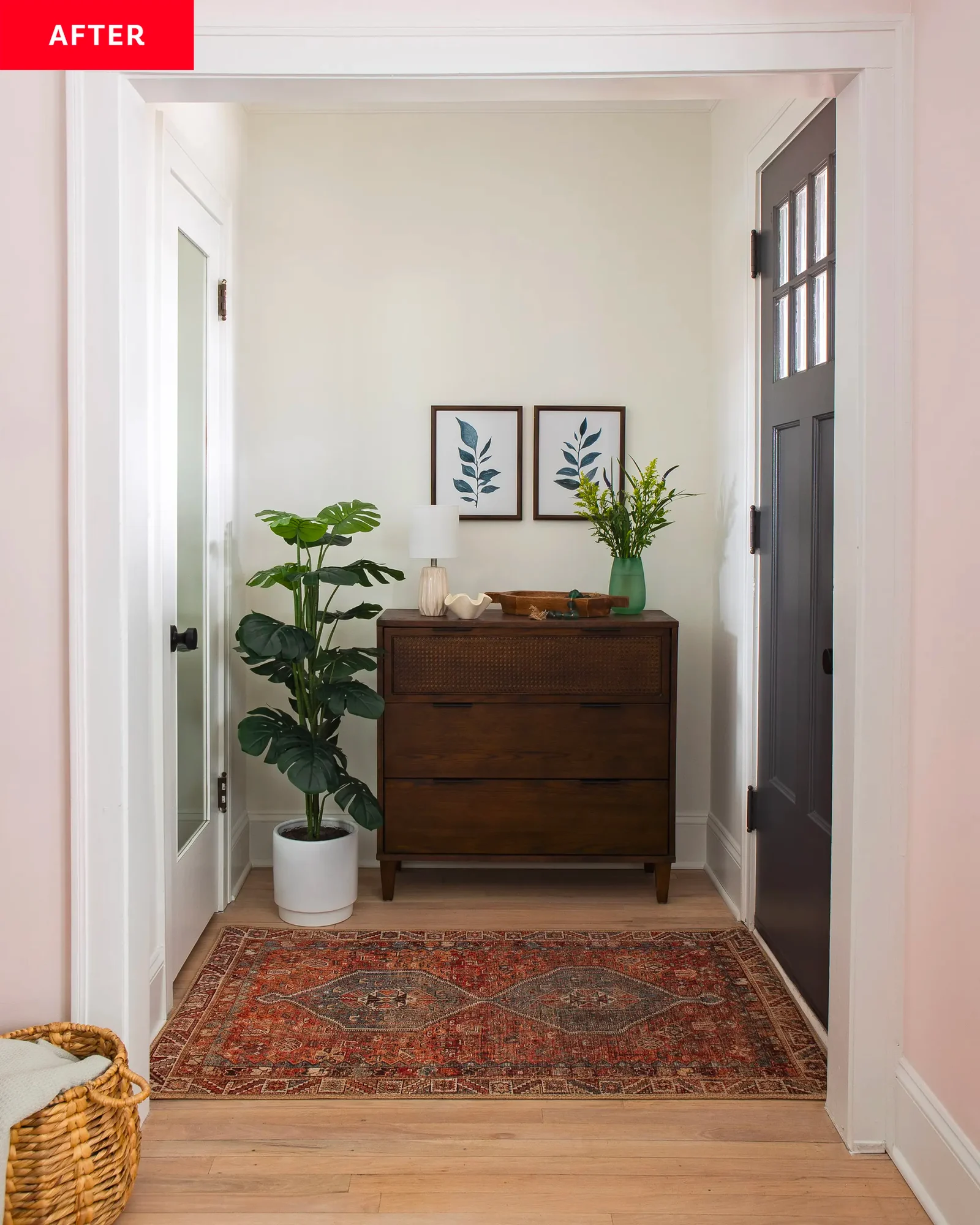 Refreshed entryway after styling, featuring a wooden console table, potted fiddle leaf fig, and an intricate oriental rug creating a serene welcome in a Chicago bungalow.