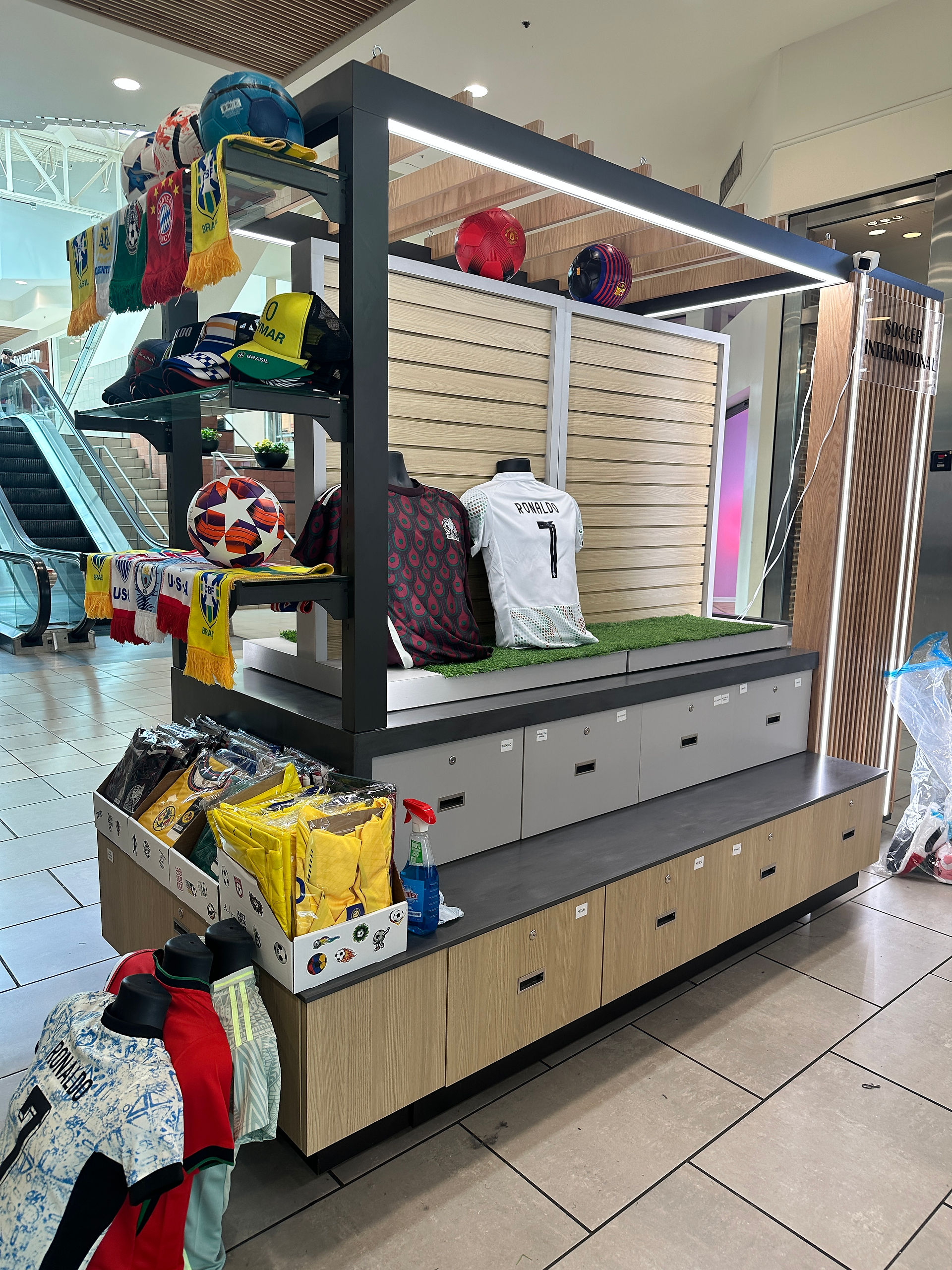 Modern RMU showcasing neatly arranged hats, scarves, and clothing after visual merchandising improvements.