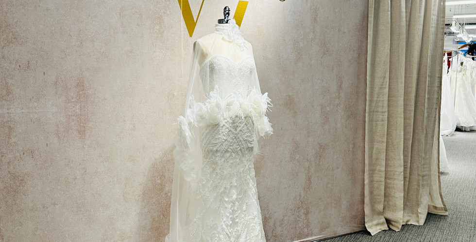 Mannequin styled in bridal gown under Veni Infantino brand signage
