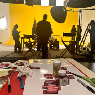 Burt's Bees lip balms and other products are arranged on a table, ready for the commercial shoot at Essanay Studios, Chicago.