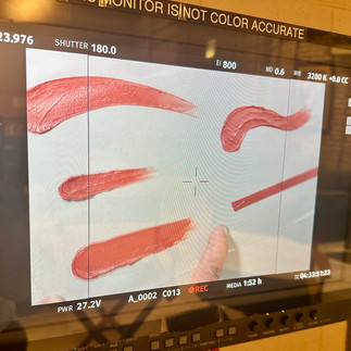 A monitor screen showing different smears of Burt's Bees tinted lip balm captured during the commercial shoot at Essanay Studios, Chicago.