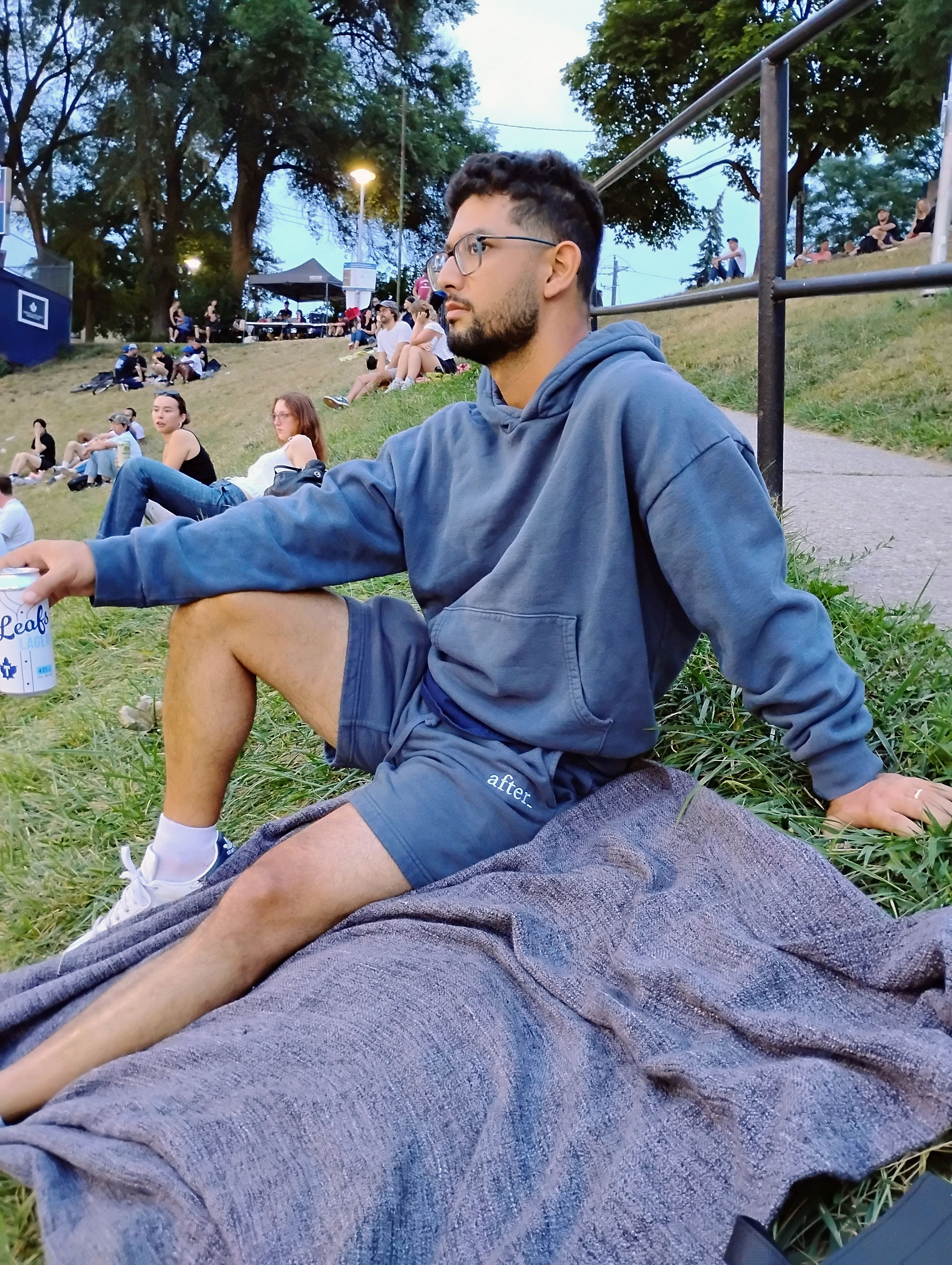 Dale enjoying the baseball game in his after_ hoodie and shorts