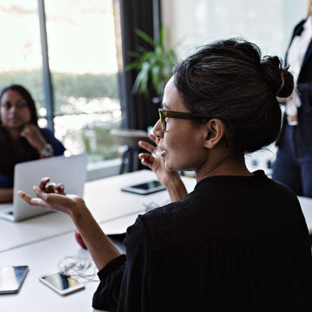 Women speaking at a table