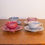 Thumbnail: Set of 4 Ruskin Pottery Arts and Crafts Harlequin Eggshell Tea Cups and Saucers