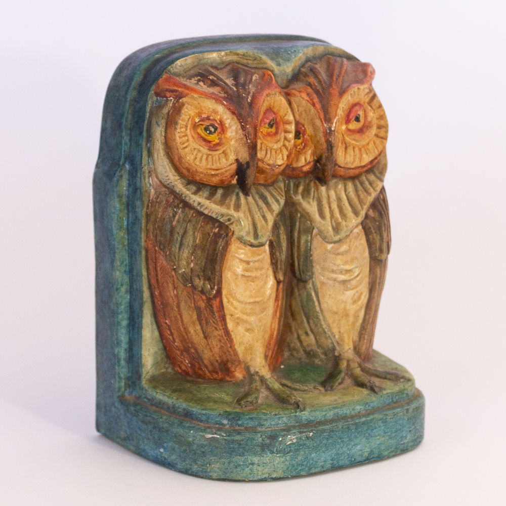 Angled view of a rare and highly collected example of an Arts and Crafts Compton pottery owl bookend by Mary Seton Watts.