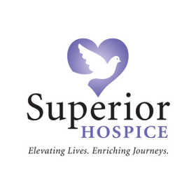 Purple heart with a dove outlined inside in white with writing, "Superior Hospice. Elevating lives. Enriching journeys"