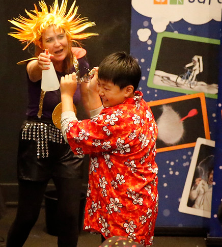 our science safari presenter takes a brave volunteer into the future to experience the weather enhanced greenhouse effect