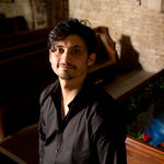 The artist Davy McGuire standing in front of the 'Ophelia' installation, created by Studio McGuire - Davy and Kristin McGuire, inspired by Shakespeare and pre-Raphaelite art.