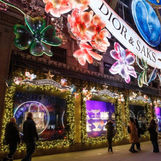 A view of the illuminated window display from Dior's Carousel of Dreams at Saks 5th Avenue, New York, featuring animated projections by Studio McGuire - Davy and Kristin McGuire.
