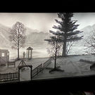 A wide shot of "The Hunter," a projection mapped paper diorama featuring video mapping, by Studio McGuire - Davy and Kristin McGuire.