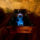 Ophelia in her water basin tomb at Aslackby Church, part of the 'Ophelia' installation by Studio McGuire - Davy and Kristin McGuire.
