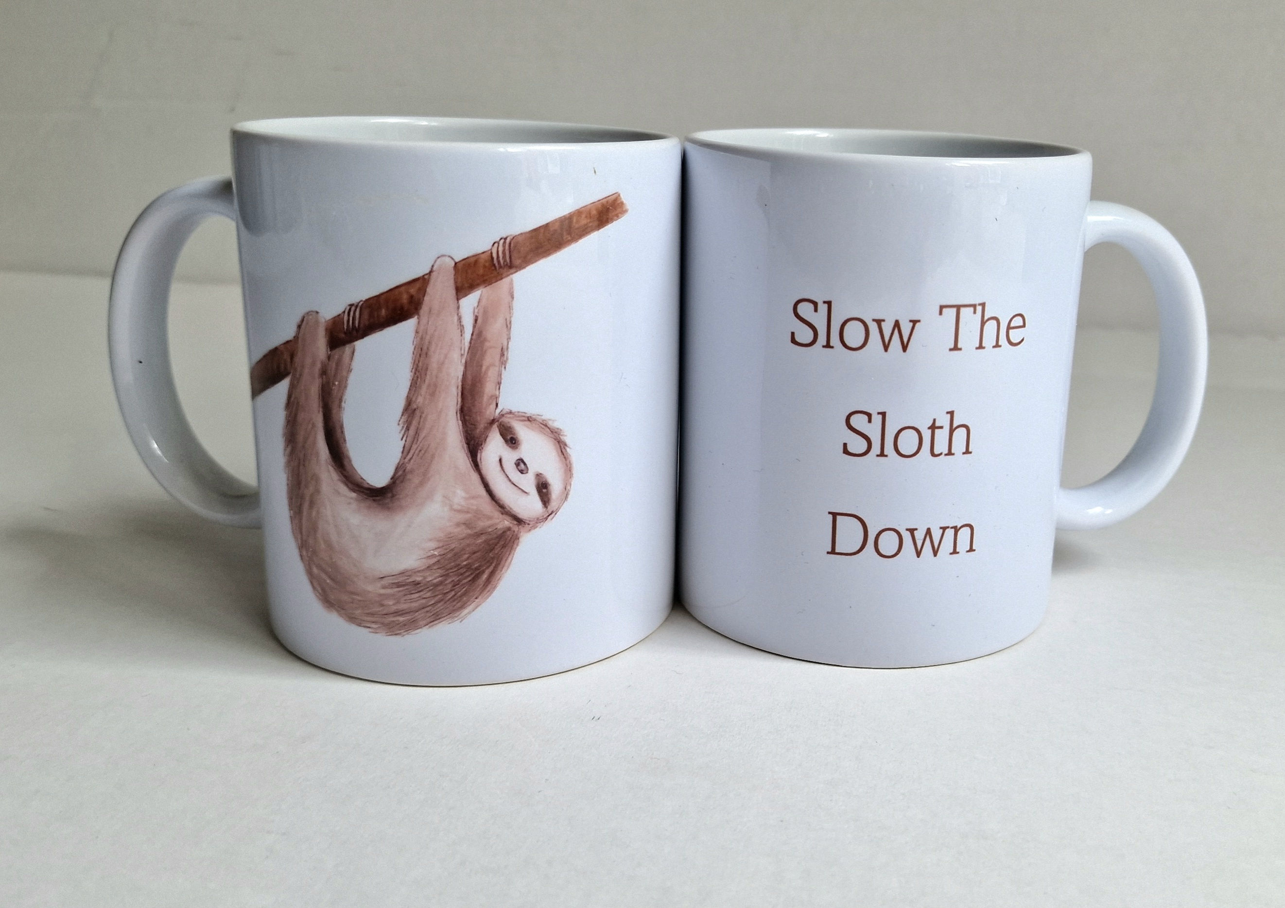 Slow The Sloth Down Mug – Funny Sloth Coffee Cup by Emma Keys